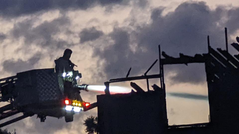 Firefighters fight the fire at Chabad House on Chapel Drive on Sunday, May 8, 2022.