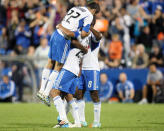 MONTREAL, CANADA - AUGUST 18: Lamar Neagle #25 of the Montreal Impact celebrates his game winning goal with teammates during the match against the San Jose Earthquakes at the Saputo Stadium on August 18, 2012 in Montreal, Quebec, Canada. The Impact defeated the Earthquakes 3-1. (Photo by Richard Wolowicz/Getty Images)