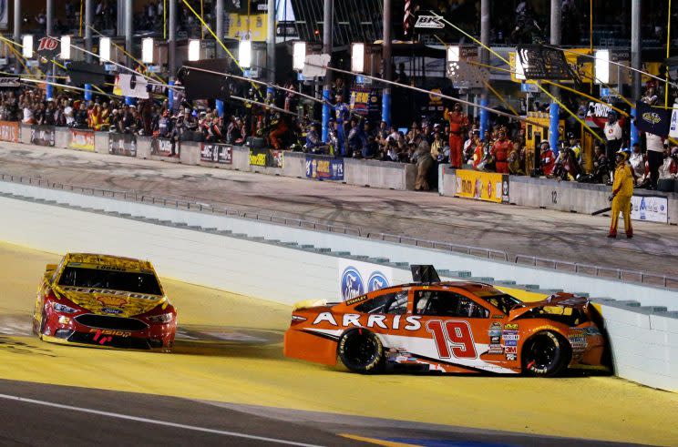 Carl Edwards crashes into the inside wall. (Getty Images)