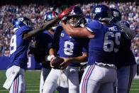 New York Giants quarterback Daniel Jones (8) celebrates after scoring on a two-point conversion during the second half of an NFL football game against the Atlanta Falcons, Sunday, Sept. 26, 2021, in East Rutherford, N.J. (AP Photo/Seth Wenig)