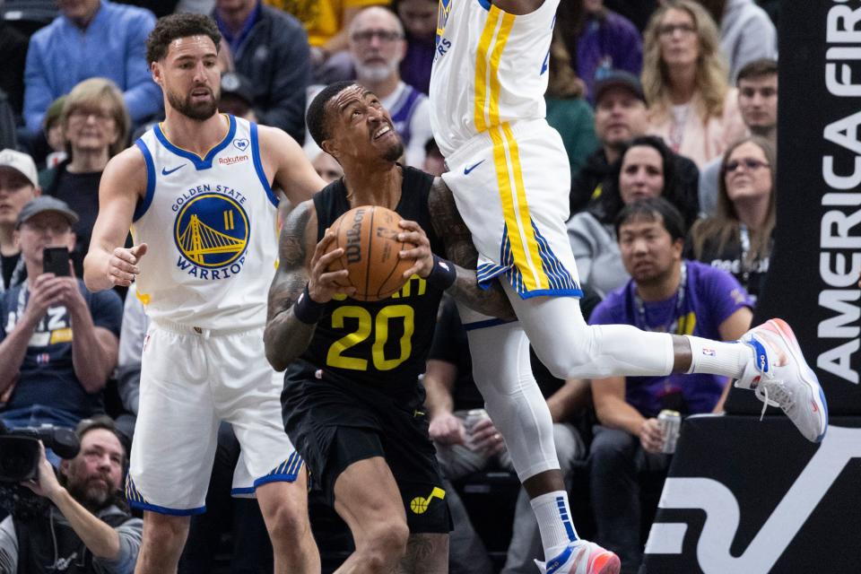 Utah Jazz forward John Collins (20) is blocked by Golden State Warriors forward <a class="link " href="https://sports.yahoo.com/nba/players/5069/" data-i13n="sec:content-canvas;subsec:anchor_text;elm:context_link" data-ylk="slk:Draymond Green;sec:content-canvas;subsec:anchor_text;elm:context_link;itc:0">Draymond Green</a> (23) during a game at the Delta Center in Salt Lake City on Monday, Feb. 12, 2024. | Marielle Scott, Deseret News