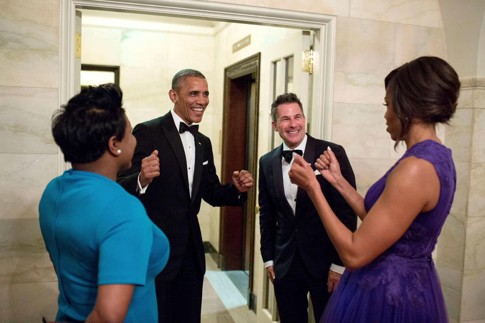 Barack Obama and Michelle Obama celebrate with outgoing social secretary Jeremy Bernard and incoming social secretary Deesha Dyer after a state&nbsp;dinner at the White House on April 28, 2015.