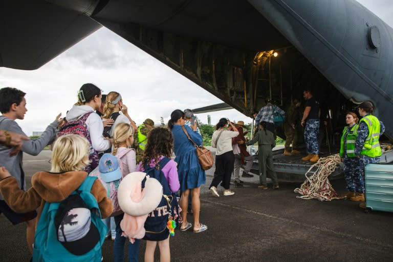 A Royal Australian Air Force C-130 Hercules aircraft evacuating people at Noumea-Magenta Airport in New Caledonia (Handout)