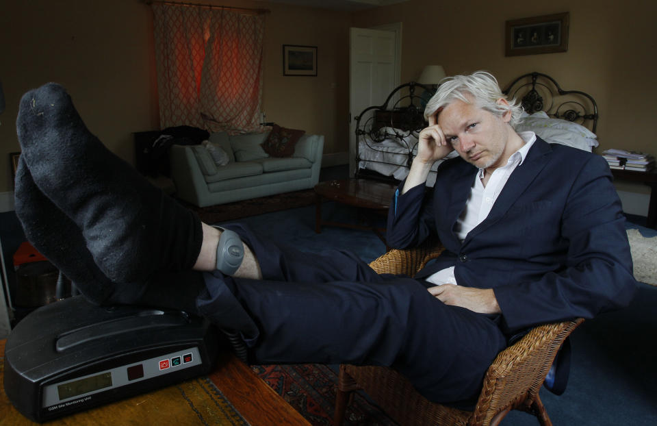 FILE - WikiLeaks founder Julian Assange is seen with his ankle security tag at the house where he is required to stay, near Bungay, England, June 15, 2011. WikiLeaks founder Julian Assange is facing what could be his final court hearing in England over whether he should be extradited to the United States to face spying charges. The High Court will hear two days of arguments next week over whether Assange can make his pitch to an appeals court to block his transfer to the U.S. (AP Photo/Kirsty Wigglesworth, file)