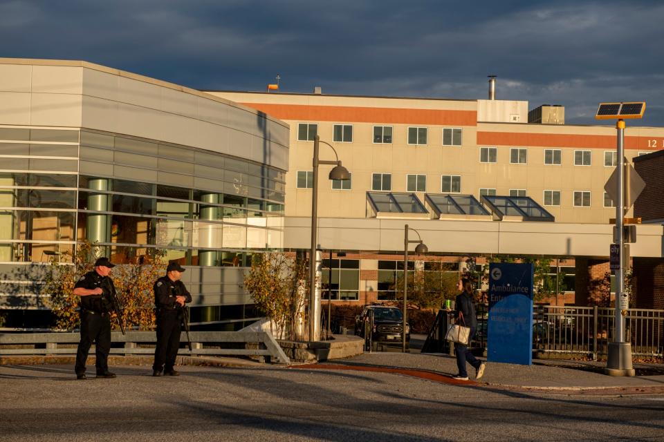 Police stand guard outside Central Maine Medical Center in Lewiston, Maine. Multiple people were killed in the area on Oct. 25, 2023.