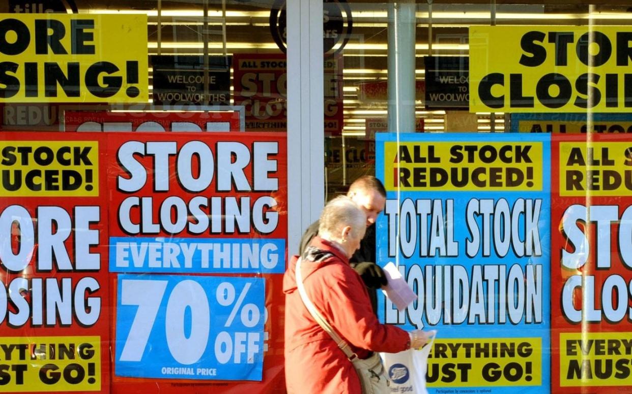 shoppers in front of a closing store. insolvencies hit highest number since financial crisis Interest rates, energy prices and pandemic loans