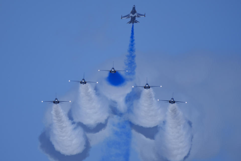 South Korean Air Force's Black Eagles aerobatic team performs during the first day of the Singapore Airshow in Singapore, Tuesday, Feb. 20, 2024. (AP Photo/Vincent Thian)