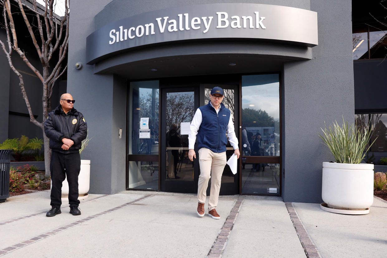 A customer leaves after speaking with FDIC representatives inside of the Silicon Valley Bank headquarters in Santa Clara, California, U.S., March 13, 2023. REUTERS/Brittany Hosea-Small