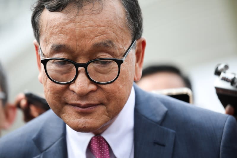 Self-exiled Cambodian opposition party founder Sam Rainsy reacts as he speaks to members of media after a visit to Parliament House in Kuala Lumpur