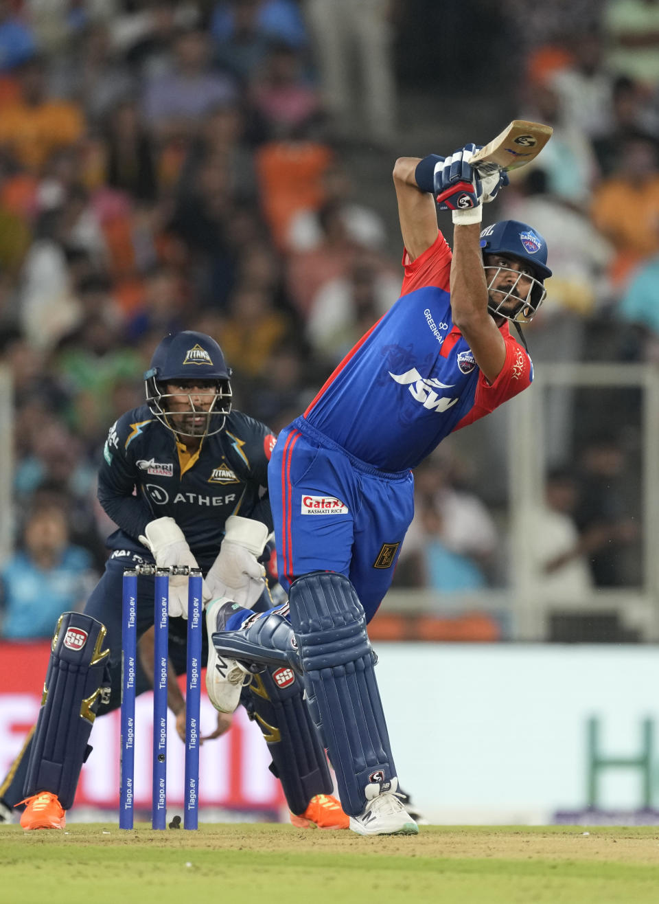 Delhi Capitals' Axar Patel plays a shot during the Indian Premier League cricket match between Gujarat Titans and Delhi Capitals in Ahmedabad, India, Tuesday, May 2, 2023. (AP Photo/Ajit Solanki)