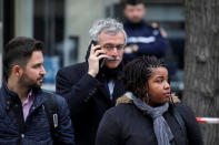 French judge Renaud Van Ruymbeke makes a phone call as French police secure the area in front of the French financial prosecutor's offices following a bomb alert in central Paris, France, March 20, 2017. REUTERS/Benoit Tessier