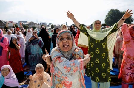 FILE PHOTO: Kashmiri women shout pro-freedom slogans before offering Eid-al-Adha prayers at a mosque in Srinagar