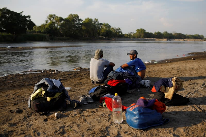 Migrant travelling to the U.S. gather by the Suchiate river at the border between Guatemala and Mexico, in Tecun Uman