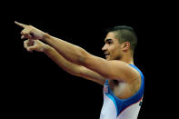 LONDON, ENGLAND - JANUARY 10: Louis Smith of Great Britain reacts after competing on the Pommel Horse during day one of the Men's Gymnastics Olympic Qualification round at North Greenwich Arena on January 10, 2012 in London, England. (Photo by Paul Gilham/Getty Images)