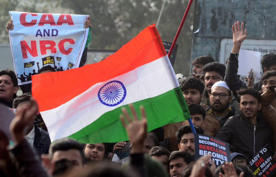 Protesters shout with placards during a demonstration against India's new citizenship law CAA ( Citizenship amandment Act ) in Allahabad on December 19,2019 . Indians defied bans nationwide as anger swells against a citizenship law seen as discriminatory against muslims, following days of protest, clashes, and riots that have left six dead .(Photo by Ritesh Shukla/NurPhoto via Getty Images)