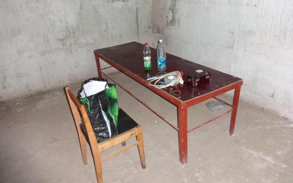 Torture equipment: a table to which the prisoners were tied, a field telephone, wires, and water to wet the contact of the wire with the skin  - Telegram channel "Donetsk Tractor Driver"