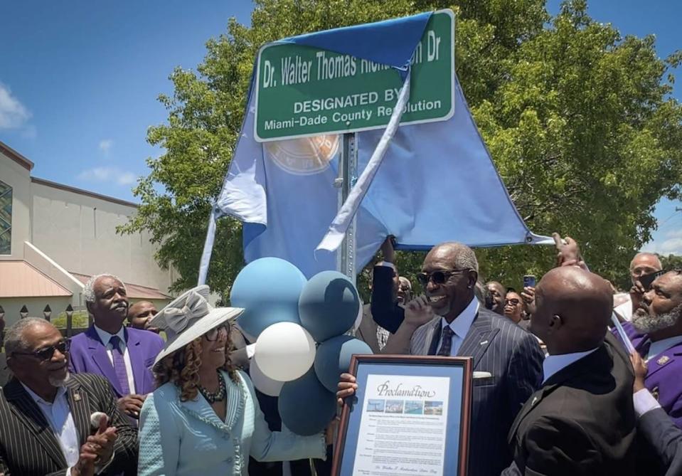 M. Dolores Richardson, center-left, and husband Dr. Walter Thomas Richardson, center-right, stand underneath the sign that bears his name during the street naming ceremony. On Sunday, June 4, 2023 Miami-Dade Commissioner Kionne L. McGhee hosted a street naming ceremony to honor community leader Dr. Walter Thomas Richardson at Sweet Home Missionary Baptist Church, 10701 SW 184th St., Miami, FL 33157.