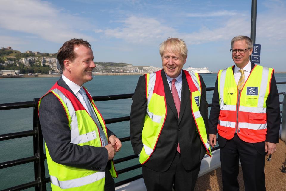 Conservative MP and leadership contender Boris Johnson (C) speaks with Dover's Conservative MP, Charlie Elphicke (L) and Doug Bannister (R), chief executive officer of Port of Dover Ltd. during a visit to the Port of Dover Ltd. during his Conservative Party leadership campaign tour, in Dover, on the southern coast of England on July 11, 2019. - Britain's leadership contest is taking the two contenders on a month-long nationwide tour where they will each attempt to reach out to grassroots Conservatives in their bid to become prime minister. (Photo by Chris Ratcliffe / POOL / AFP)        (Photo credit should read CHRIS RATCLIFFE/AFP via Getty Images)