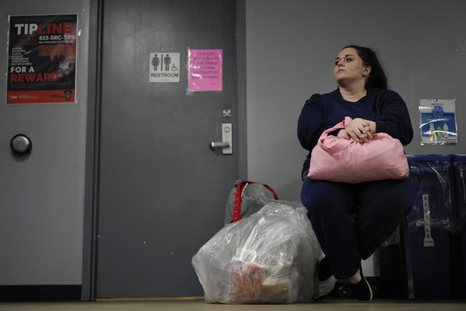 Heather Jarvis waits with her belongings for transportation after being processed for release at the Ohio Reformatory for Women, in Marysville, Ohio, Wednesday, Oct. 25, 2023. Jarvis is part of the fastest-growing prison population in the country, one of more than 190,000 women held in some form of confinement in the United States as of this year. Their numbers grew by more than 500% between 1980 and 2021. (AP Photo/Carolyn Kaster)