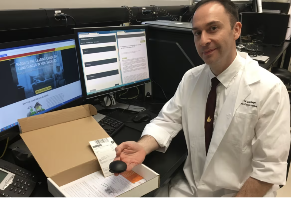 Dr. Aaron Goodarzi, pictured here with a radon test kit, wants people from across the province to participate in the Evict Radon campaign. (Elissa Carpenter/CBC)