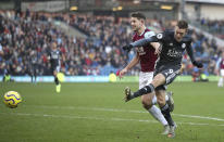 Leicester City's Jamie Vardy, right, has an unsuccessful shot on goal under pressure form Burnley's James Tarkowski, during their English Premier League soccer match at Turf Moor in Burnley, England, Sunday Jan. 19, 2020. (Nick Potts/PA via AP)