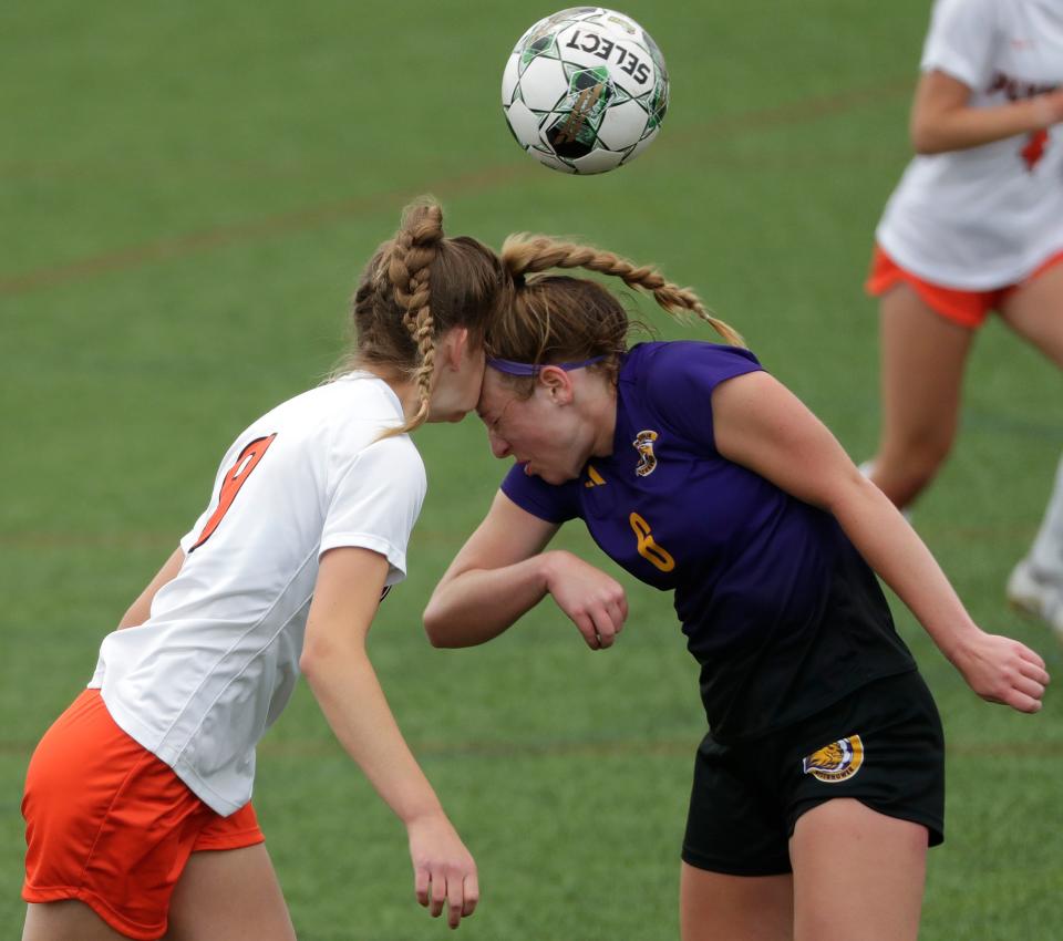 Plymouth High School's Hanah Downs (9) and New Berlin Eisenhower's Claire Markofski (6) collide going for a head ball during their WIAA Division 3 girls soccer semifinal game Thursday, June 15, 2023, at Uihlein Soccer Park in Milwaukee, Wis. Downs was helped off the field, but returned later in the first half.