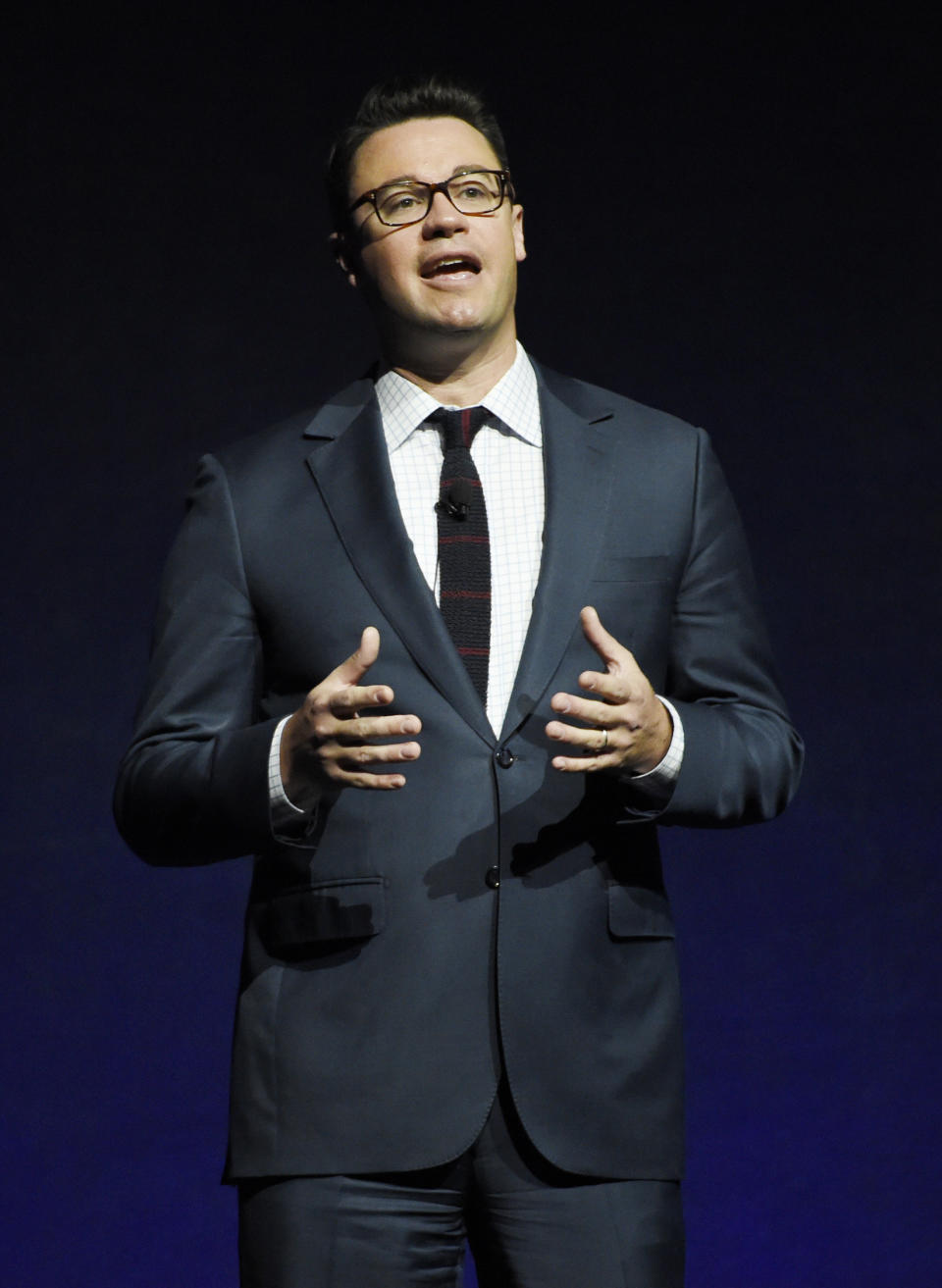 FILE - Dave Hollis, executive vice president of theatrical distribution for Walt Disney Studios Motion Pictures, addresses the audience during the studio's presentation at CinemaCon 2016, the official convention of the National Association of Theatre Owners, at Caesars Palace on April 13, 2016, in Las Vegas. Hollis, who left his spot as a Disney executive to join this then-wife Rachel Hollis in running her lifestyles empire, which include her bestselling book “Girl, Wash Your Face,” has died at his home in Texas on Sunday, Feb. 12, 2023. He was 47. (Photo by Chris Pizzello/Invision/AP, File)