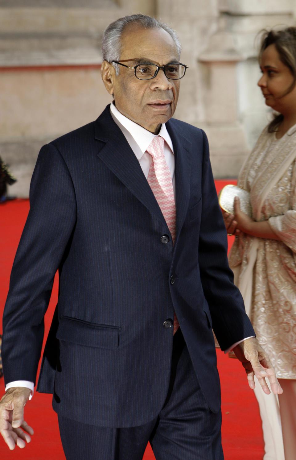 FILE - In this Thursday, April 15, 2010 file photo, Srichand Hinduja arrives for the private viewing of the exhibition 'Grace Kelly: Style Icon', at the Victoria & Albert Museum in London. A new study of the super-rich finds that London has become the capital of the world's wealthiest, with more billionaires than any other city in the world. Indian-born brothers Srichand and Gopichand Hinduja top the list, with a 11.9-billion pound fortune. The two run the Hinduja Group conglomerate. (AP Photo/Joel Ryan, File)