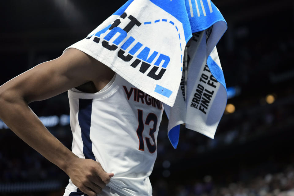 Virginia guard Ryan Dunn reacts after the team lost to Furman in a first-round college basketball game in the NCAA Tournament Thursday, March 16, 2023, in Orlando, Fla. (AP Photo/Chris O'Meara)