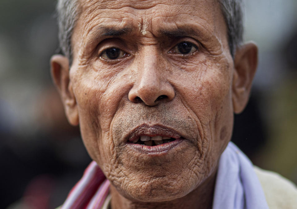 In this Monday, Dec. 23, 2019, photo, Ananta Ram Hazarika, 75, participates in a protest against the Citizenship Amendment Act (CAA) in Gauhati, India. Tens of thousands of protesters have taken to India’s streets to call for the revocation of the law, which critics say is the latest effort by Narendra Modi’s government to marginalize the country’s 200 million Muslims. Hazarika said the people of Assam were warriors and would not spare the India Government if the act was not withdrawn. (AP Photo/Anupam Nath)