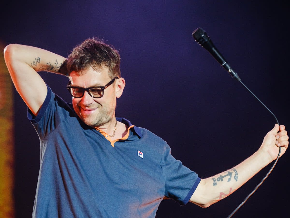 Blur’s Damon Albarn does his best to bring some energy back into the arena after a downpour  (Hugo Lima)
