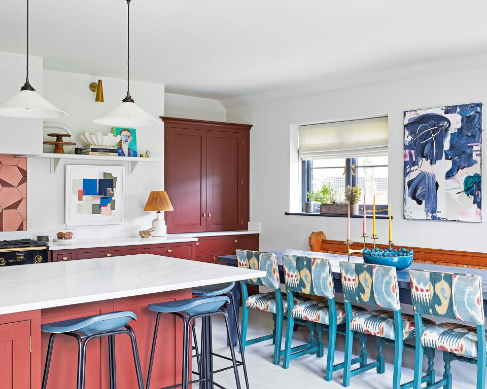 Decorative red and white kitchen with art