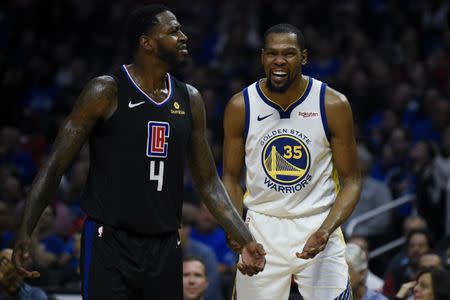 Apr 18, 2019; Los Angeles, CA, USA; Golden State Warriors forward Kevin Durant (35) and Los Angeles Clippers forward JaMychal Green (4) both react after they both receive a technical foul during the second half in game three of the first round of the 2019 NBA Playoffs at Staples Center. Mandatory Credit: Kelvin Kuo-USA TODAY Sports
