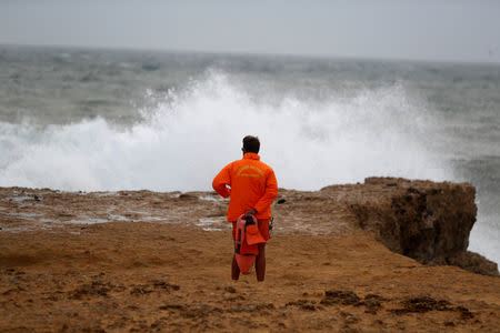 A lifeguard watches at Carcavelos beach before hurricane Leslie arrives to Portugal coast, near Cascais, Portugal October 13, 2018. REUTERS/Rafael Marchante