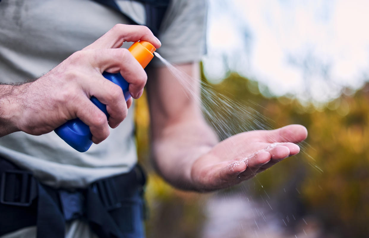 Man applying sunscreen on hand