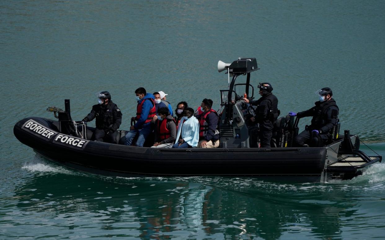 People thought to be migrants crossing the Channel in small boats are picked up by Border Force officials. Priti Patel wants to send Channel migrants to Rwanda, but the Foreign Office raised concerns about the country's human rights record - AP Photo/Matt Dunham