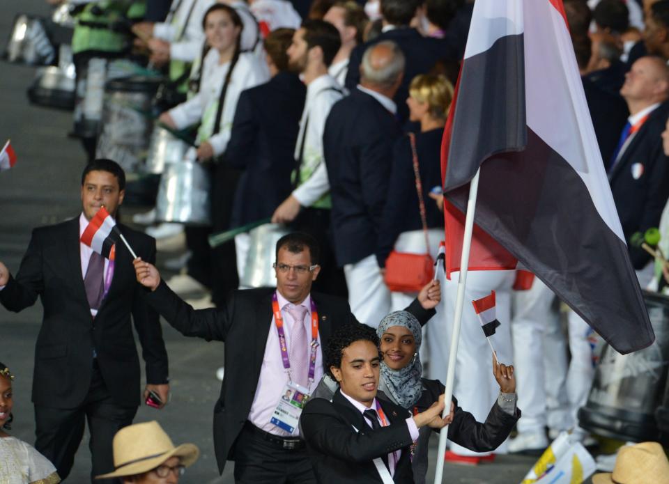 Yemen's flagbearer Tameem Mohammed Ahmed al-Kubati (R) leads his delegation during the opening ceremony of the London 2012 Olympic Games on July 27, 2012 at the Olympic Stadium in London. AFP PHOTO / GABRIEL BOUYSGABRIEL BOUYS/AFP/GettyImages