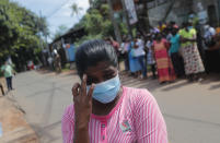 A woman weeps as family members of the inmates of Sri Lanka's Mahara prison complex gather demanding information on the condition of their relatives following an overnight unrest in Mahara, on the outskirts of Colombo, Sri Lanka, Monday, Nov. 30, 2020. Sri Lankan officials say six inmates were killed and 35 others were injured when guards opened fire to control a riot at a prison on the outskirts of the capital. Two guards were critically injured. Pandemic-related unrest has been growing in Sri Lanka's overcrowded prisons. (AP Photo/Eranga Jayawardena)