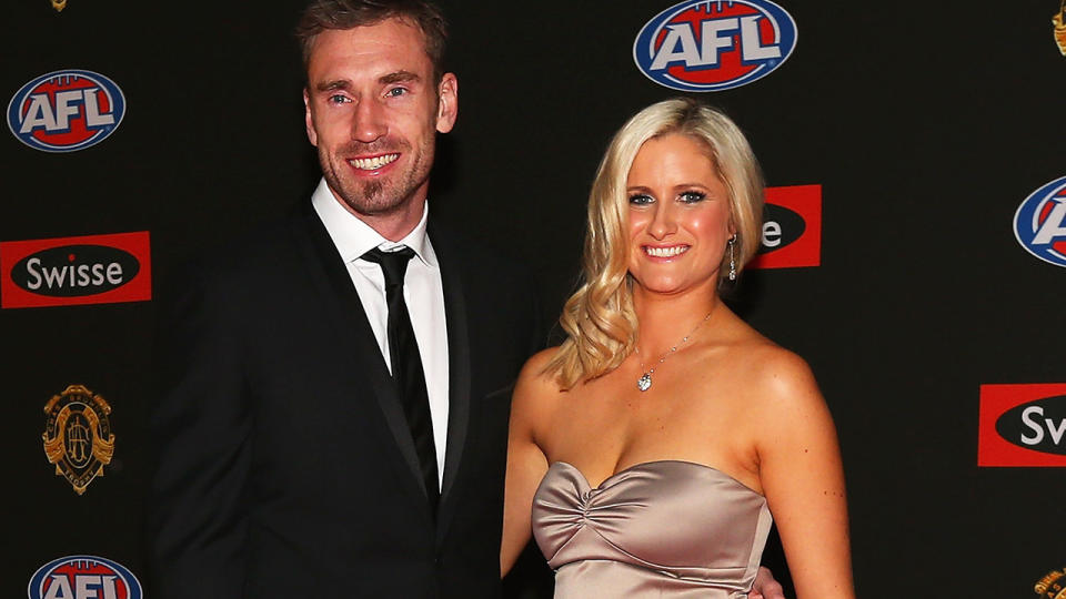 Shane Tuck and his wife Katherine are pictured posing on the read carpet before the 2012 Brownlow Medal count.