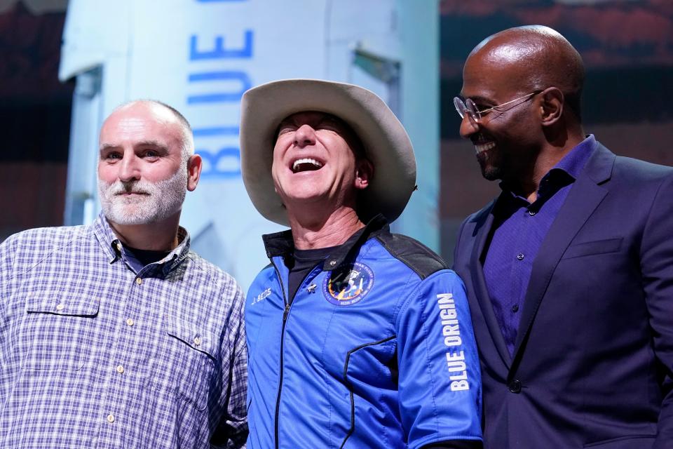 Jeff Bezos, center, founder of Amazon and space tourism company Blue Origin, poses for photos with Chef José Andrés, left, and Van Jones, right, founder of Dream Corps, during a briefing following the launch of the New Shepard rocket from its spaceport near Van Horn, Texas, Tuesday, July 20, 2021.