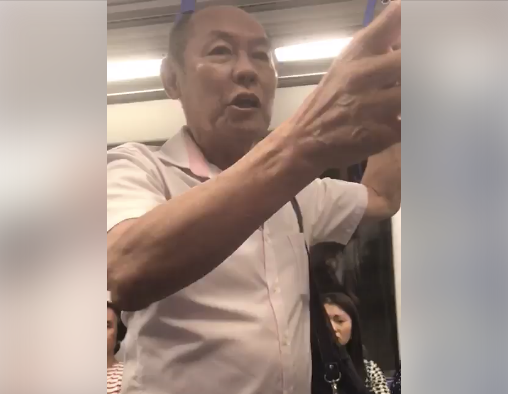 A man was seen harassing and slapping an American in an MRT train on Wednesday (19 April). (Photo” Screenshot of video posted on Facebook by Joe DeMarini)