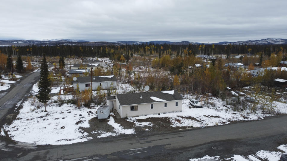 Homes are shown Thursday, Sept. 23, 2021, in Tanacross, Alaska. Tanacross, a village of about 140 residents, has recorded only one death, and only about 20 residents contracted the virus during the pandemic. Alaska is experiencing one of the sharpest rises in COVID-19 cases in the country, coupled with a limited statewide healthcare system that is almost entirely reliant on Anchorage hospitals. (AP Photo/Rick Bowmer)