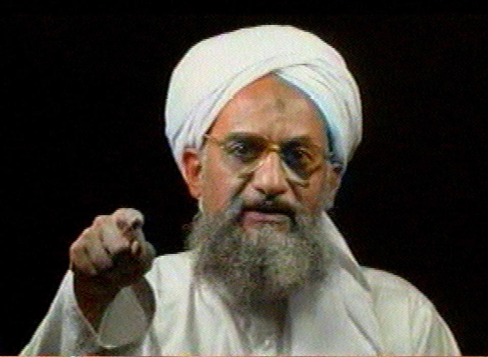 FILE - In this file image from television transmitted by the Arab news channel Al-Jazeera on Monday Jan. 30, 2006, Al-Qaida's then deputy leader Ayman al-Zawahri gestures while addressing the camera. Al-Qaida's central leadership broke with one of its most powerful branch commanders, who in defiance of its orders spread his operations from Iraq to join the fighting in Syria and fueled bitter infighting among Islamic militant factions in Syria’s civil war. The break, announced in a statement Monday, appeared to be an attempt by Al-Zawahri, to establish control over the feuding militant groups in Syria and stem the increasingly bloody reprisals among them. (AP Photo/Al-Jazeera, File)