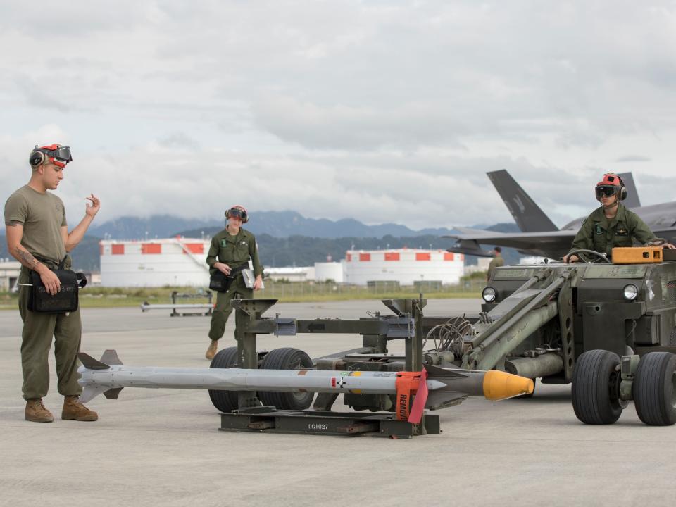 US Marines with Marine Fighter Attack Squadron (VMFA) 121 transport an AIM-9X Sidewinder missile at Marine Corps Air Station (MCAS) Iwakuni, Japan, Sept. 28, 2022.