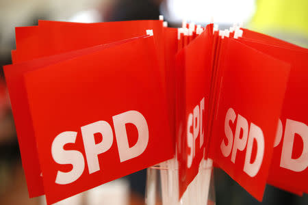 Social Democratic Party (SPD) flags are pictured during the traditional Ash Wednesday meeting in Vilshofen, Germany February 14, 2018. REUTERS/Michaela Rehle