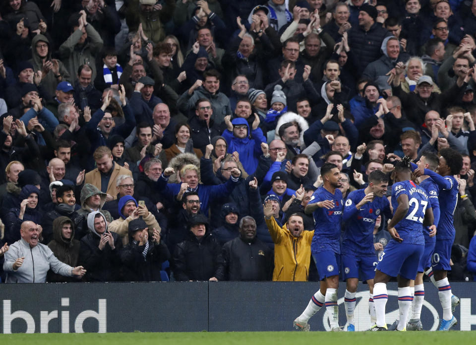 Chelsea's Christian Pulisic celebrates with teammates after scoring his sides second goal during their English Premier League soccer match between Chelsea and Crystal Palace at Stamford Bridge stadium in London, Saturday, Nov. 9, 2019. (AP Photo/Alastair Grant)