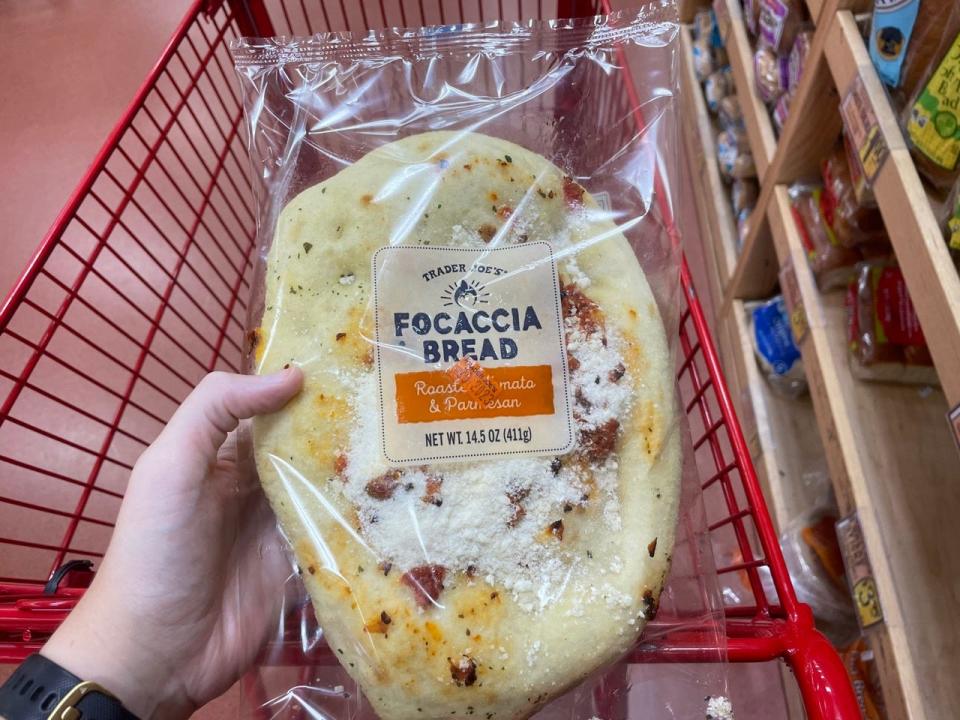 Trader Joe's foccaccia bread in hand