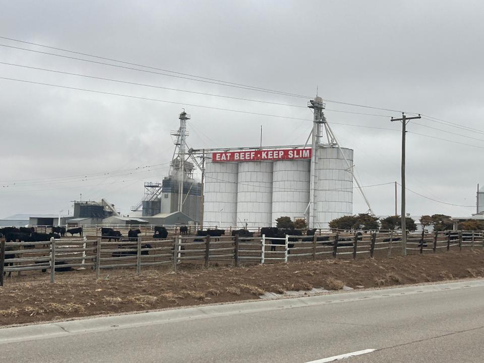 The "Eat Beef, Keep Slim" sign serves as a local monument in Garden City, Kansas, a meatpacking town that has grown into a melting pot the last few decades, with dozens of languages spoken there, including Burmese, Creole, and Swahili