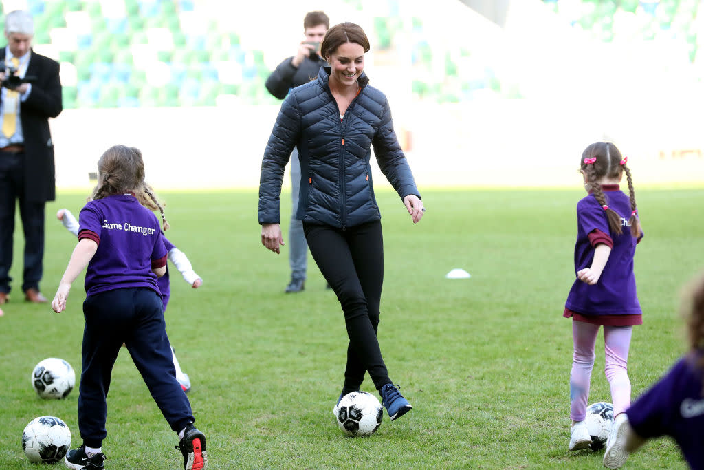 Kate Middleton plays soccer with young girls while visiting the National Stadium Belfast, home of the Irish Football Association in Belfast, Northern Ireland. (Photo: Kelvin Boyes/Press Eye/Getty Images)