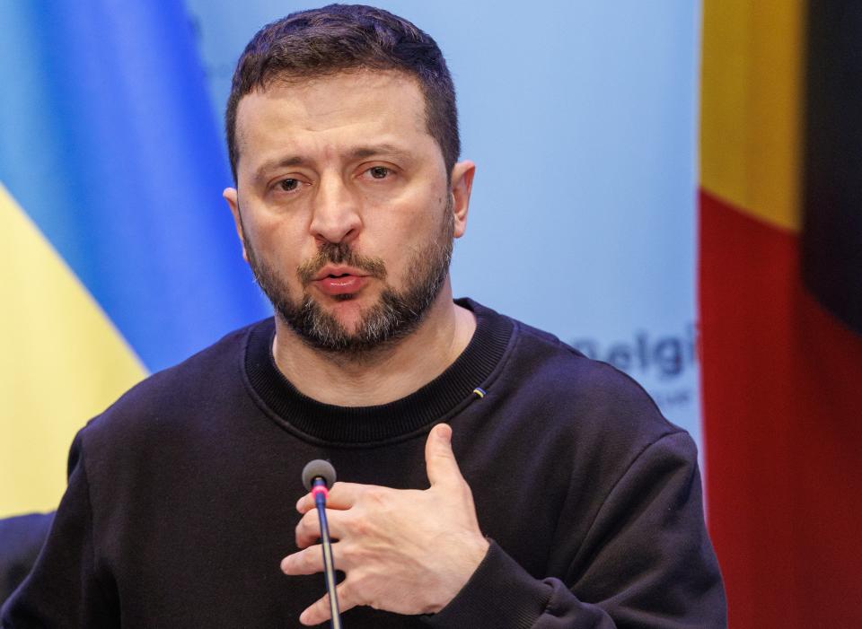 Ukraine's President Volodymyr Zelensky gestures as he addresses the media alongside Belgium's Prime Minister during a surprise visit at the Prime Minister's office in Brussels (EPA)